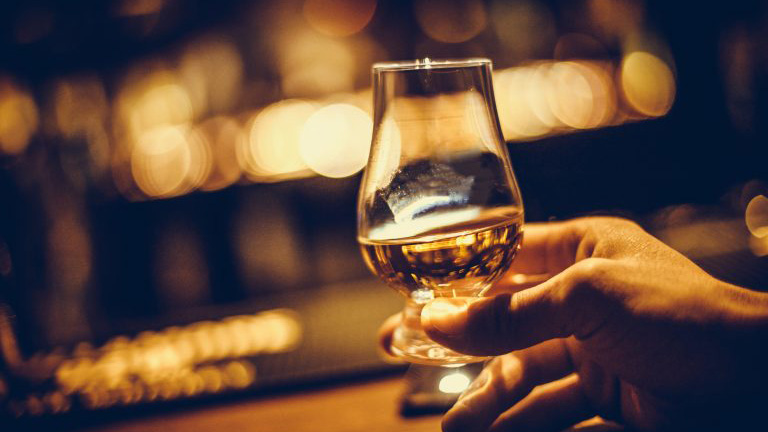 Holding Whisky Glass